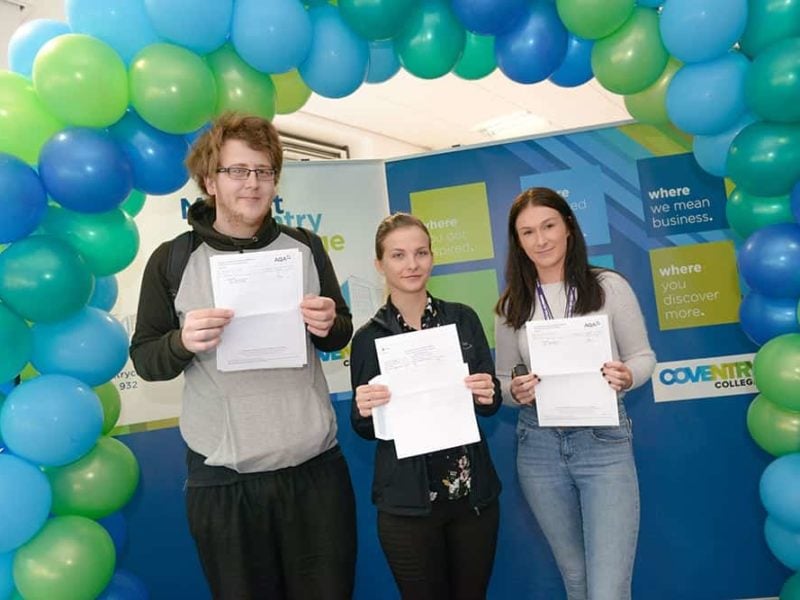Coventry college learners holding certificates on gcse results day 2019