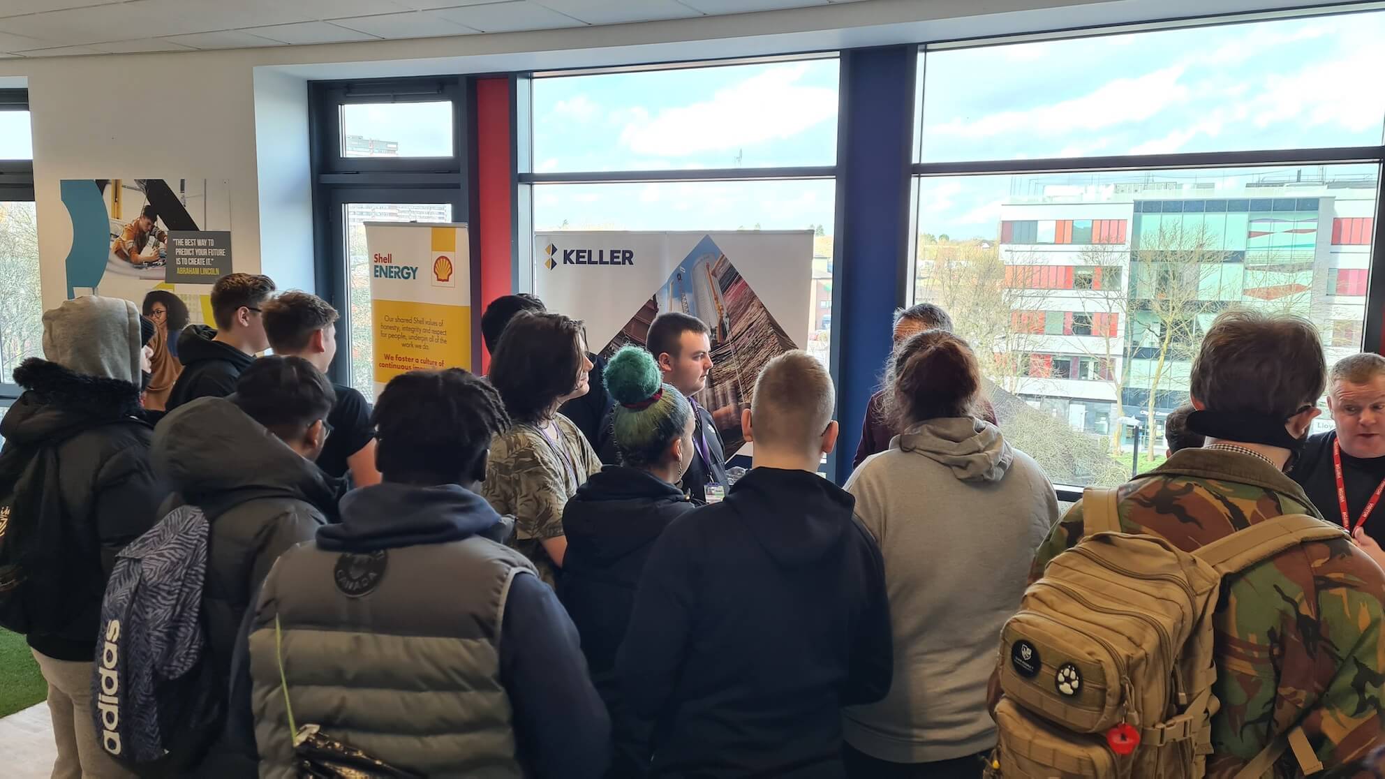 Learners speaking to employers at a motor vehicle careers fair