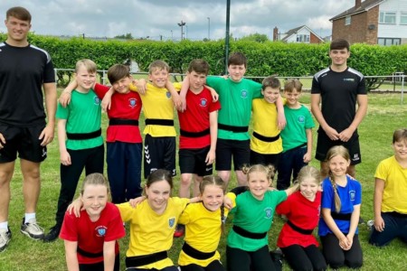 Harry english and alex hawkswood with children at eastern green junior school