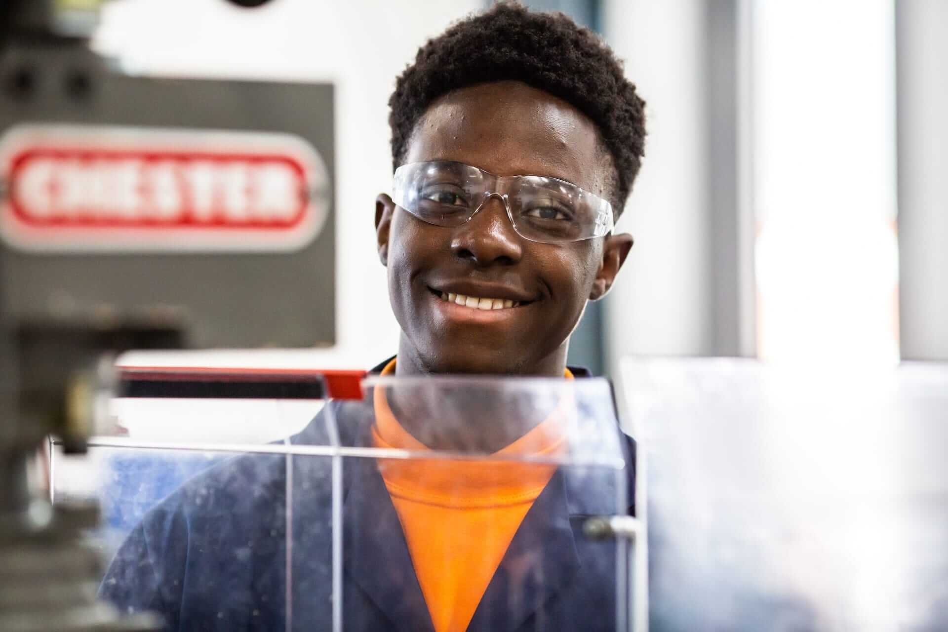 Close up of a coventry college engineering learner, wearing protective eyewear
