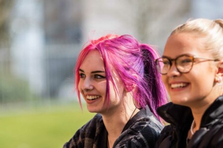 Two coventry college learners outside on campus