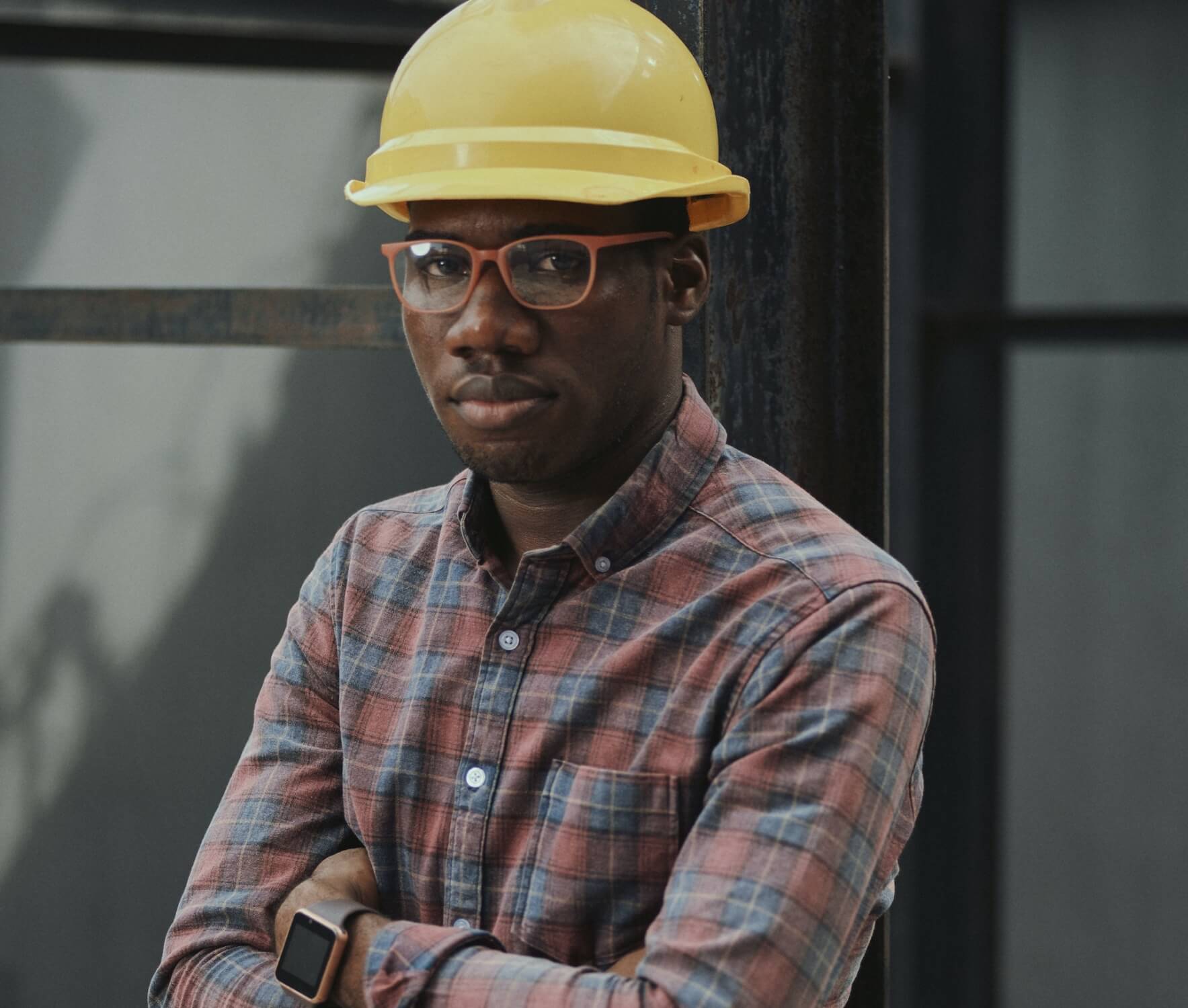 man on construction site wearing construction safety hat