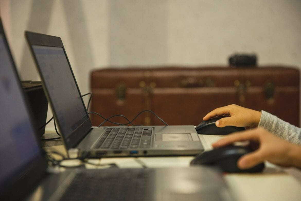 Children using laptops in school
