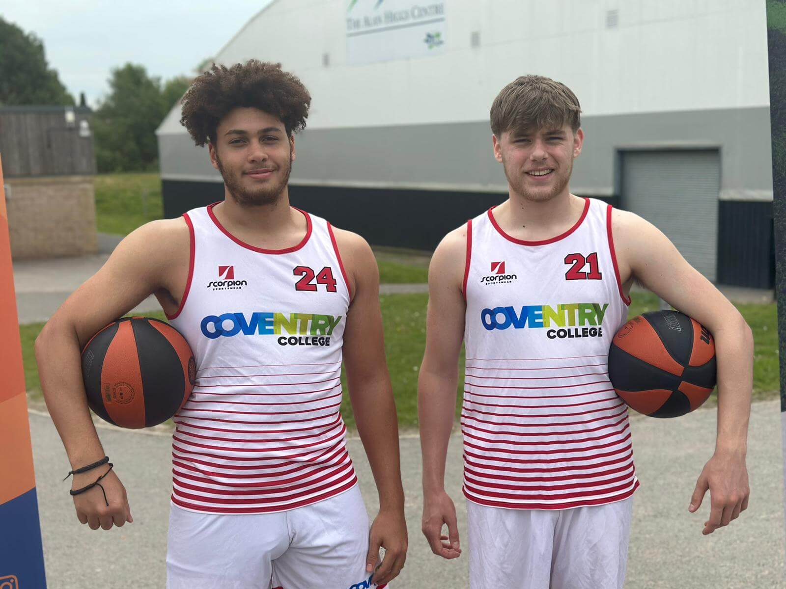 Coventry college basketball students holding basketball
