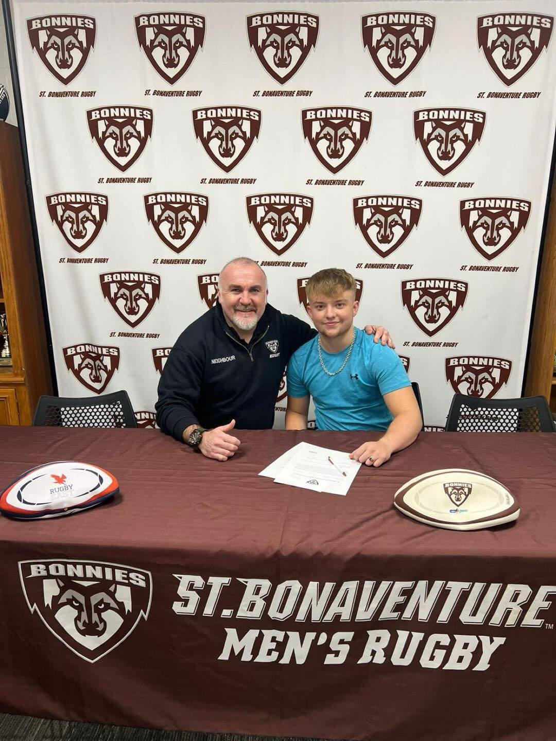 Rugby student Henry Quance with representative from St Bonaventure University