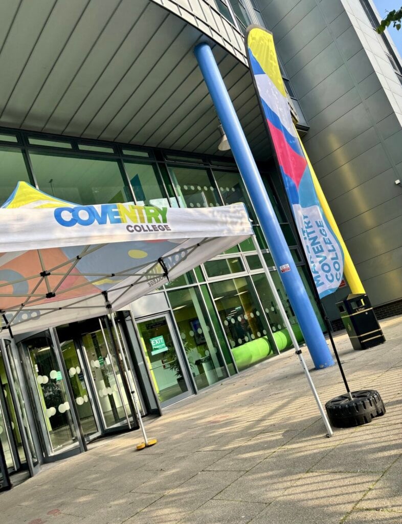 Colourful flags outside Coventry College for Open Event