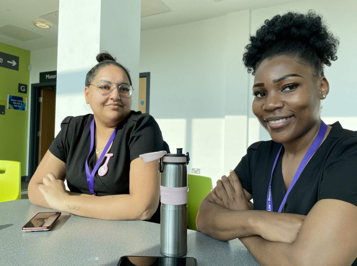 Two health learners sat in a social space at the college