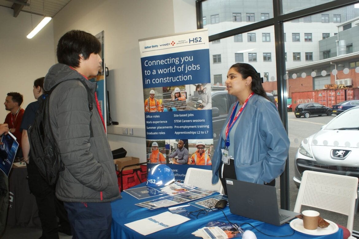 Employer talking to learner at green skills careers fair