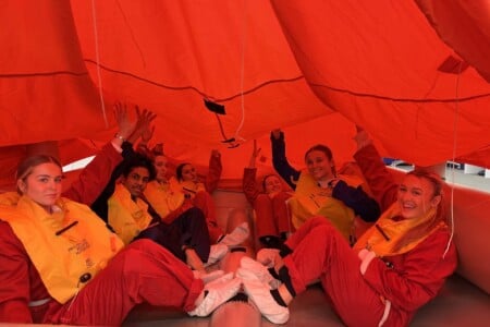 Cabin Crew students in a life raft
