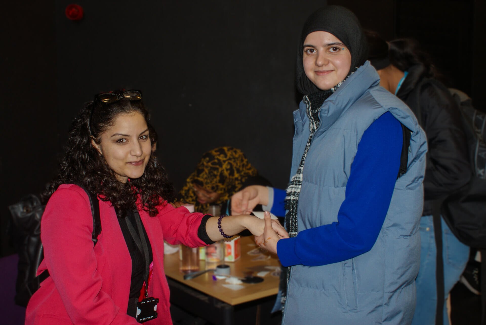 ESOL student with customer at winter fair