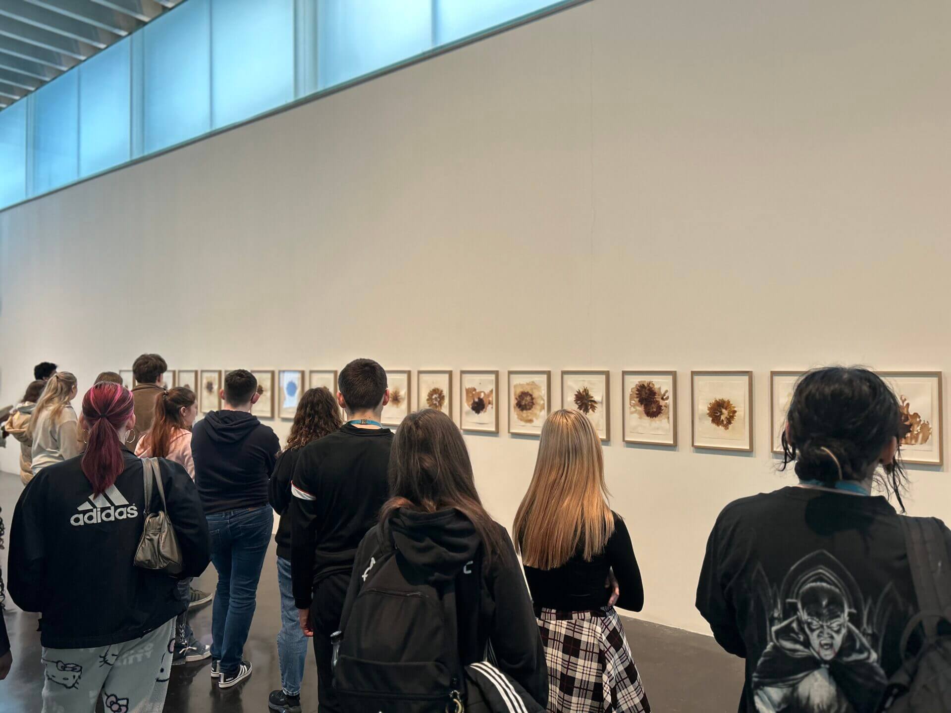 Art students looking at artwork