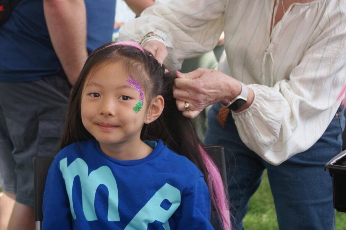 Young person having their hair braided