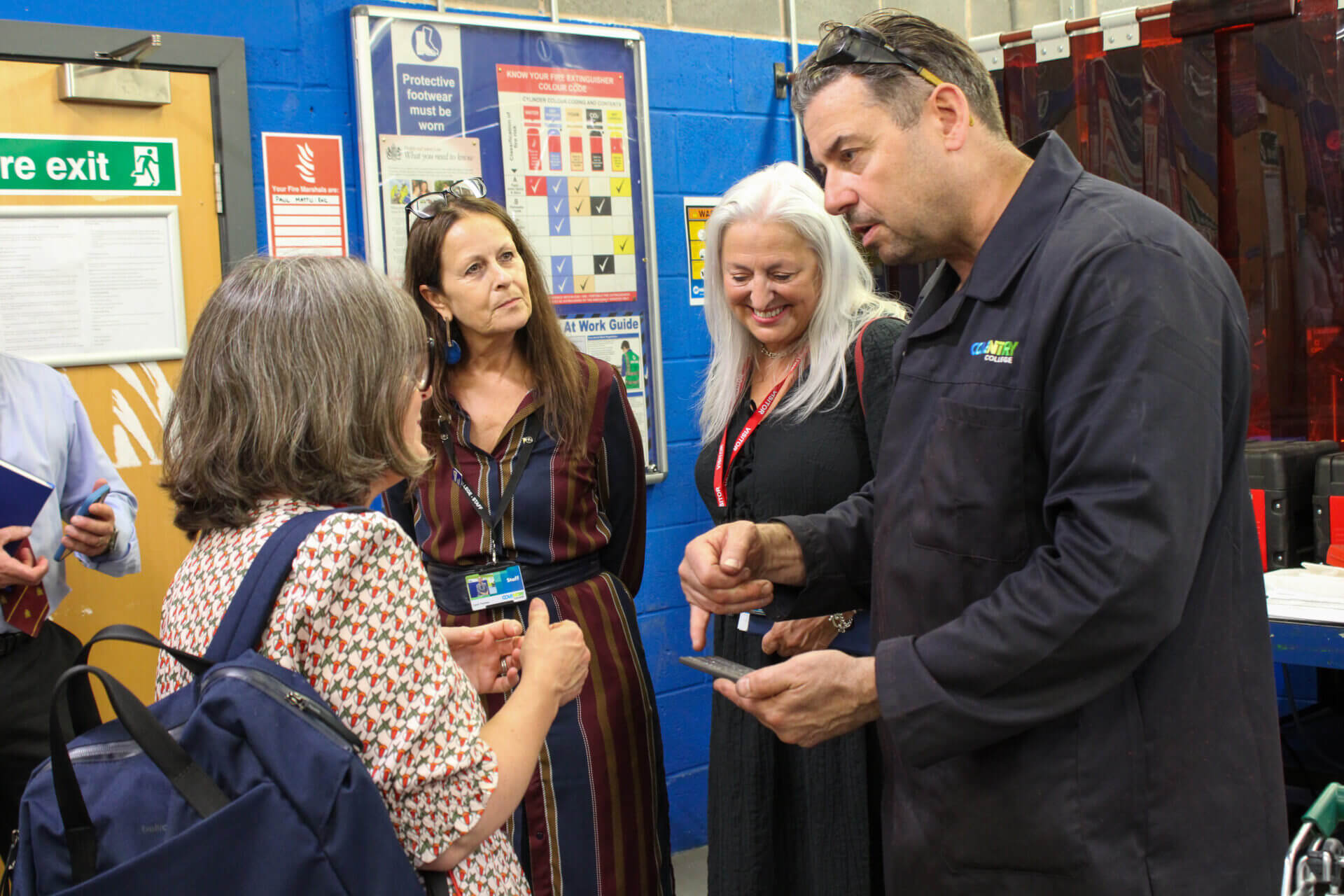 Principal, Carol, Sarah Maclean and Sarah Morris with welding class