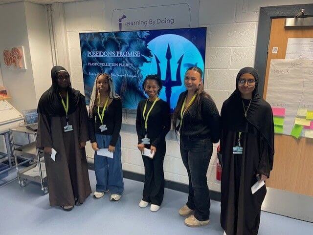 Students delivering presentation to class