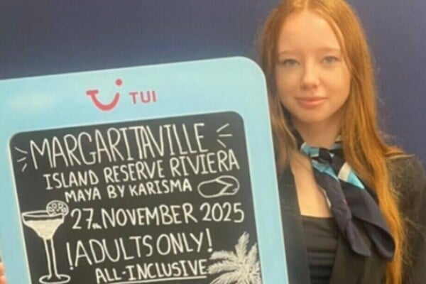 Bethanie-Rose holding up a promotional sign at TUI work experience