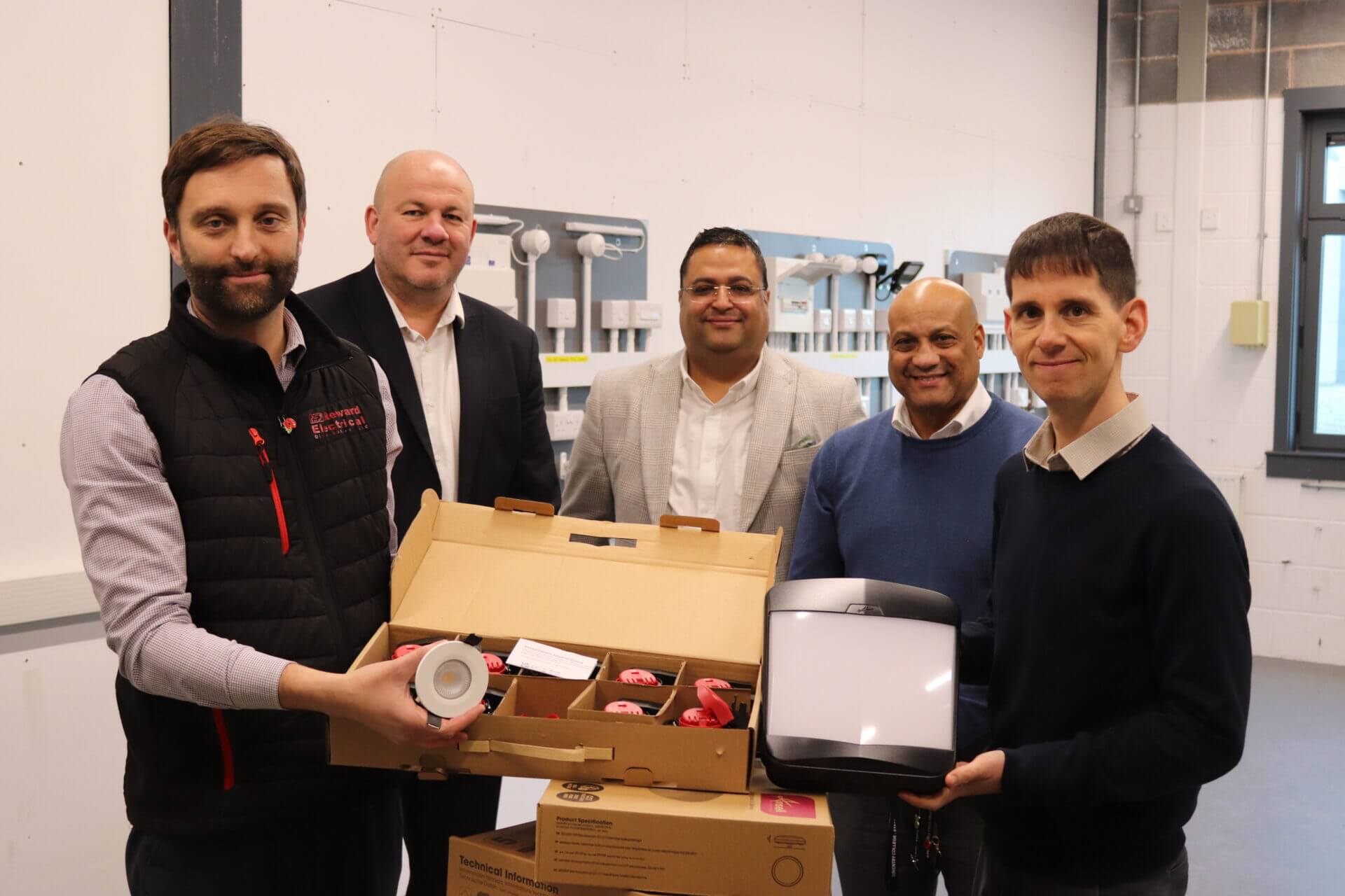 Reward, Chamber of Commerce and Coventry College construction department posing with the new donation