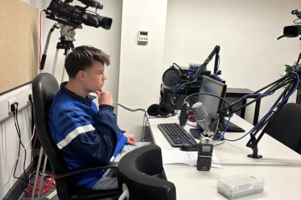 Media student sat in a radio studio