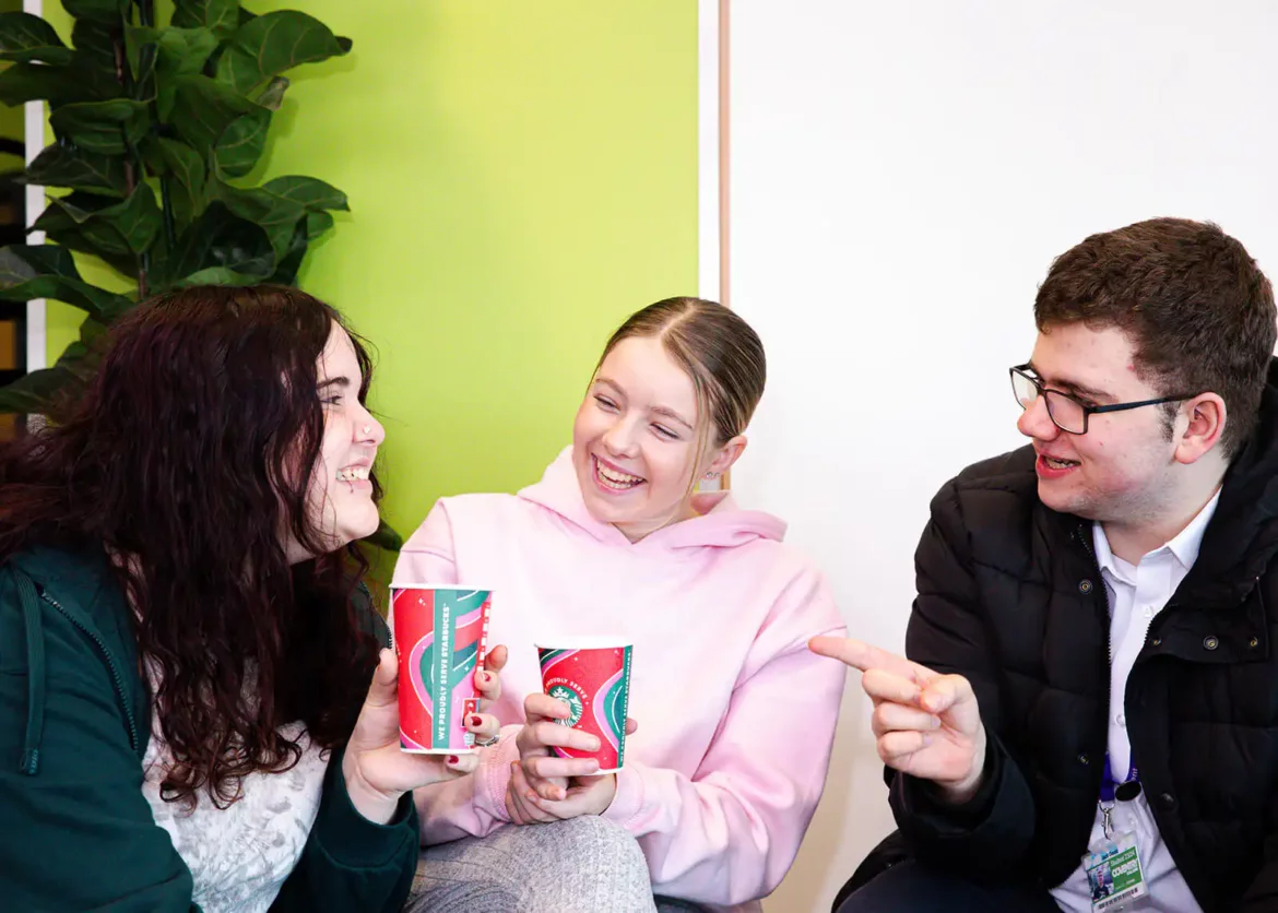 Group of students chatting in college cafe
