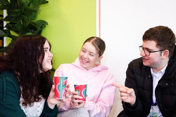 Group of students chatting in college cafe