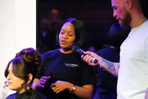 student showcasing their work on stage